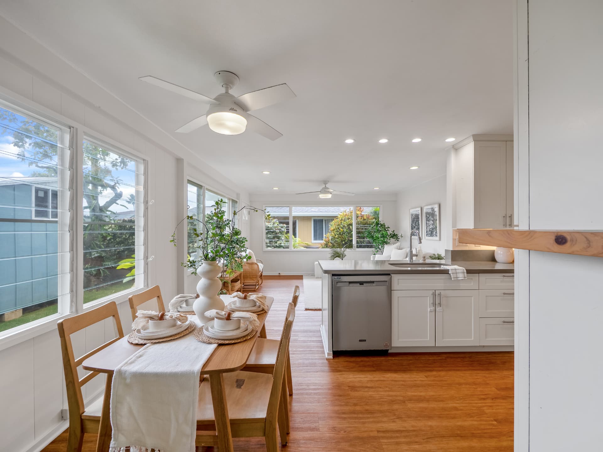 Dining area open to the renovated kitchen with island seating
