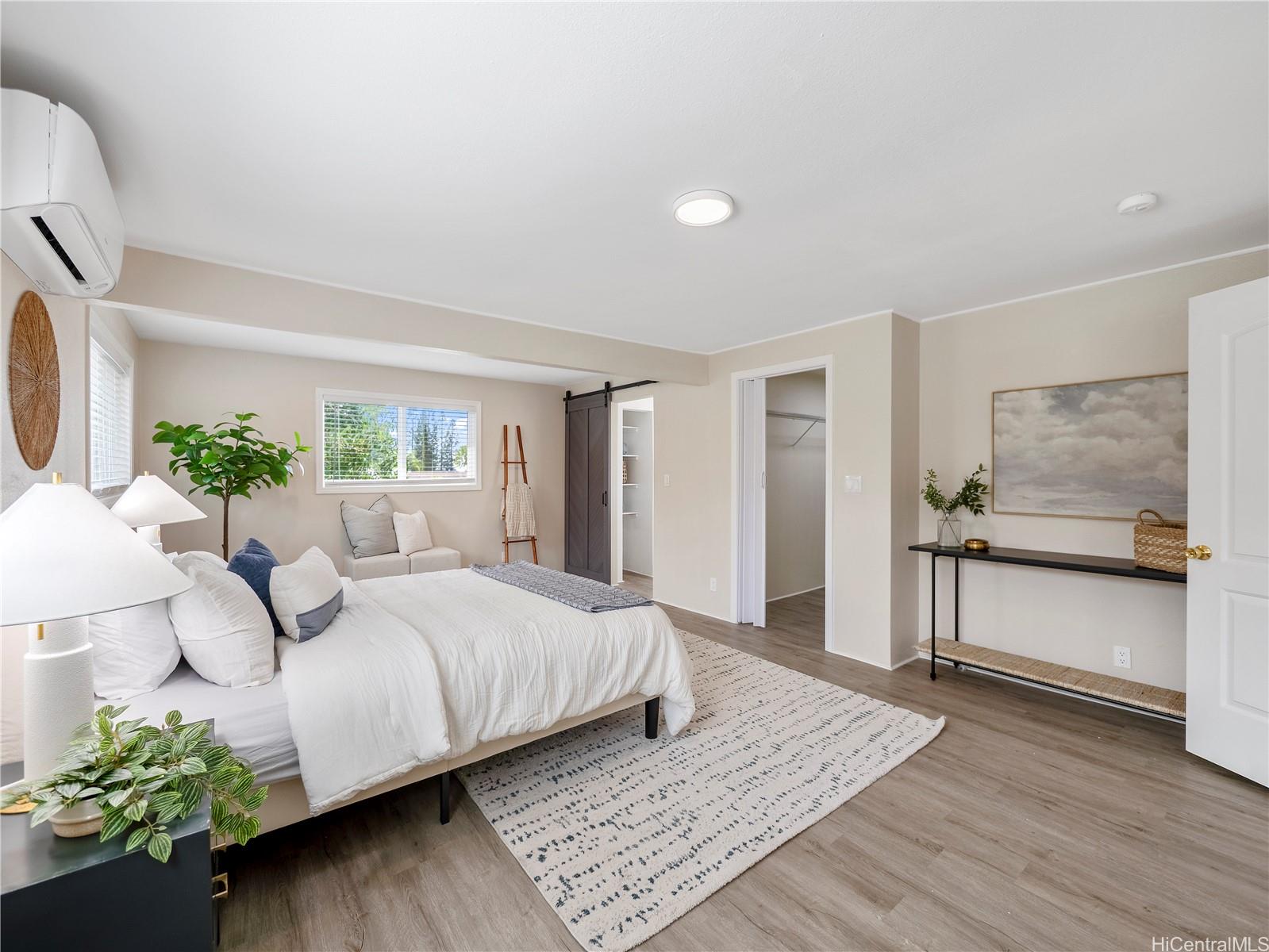 Spacious primary bedroom with walk-in closet