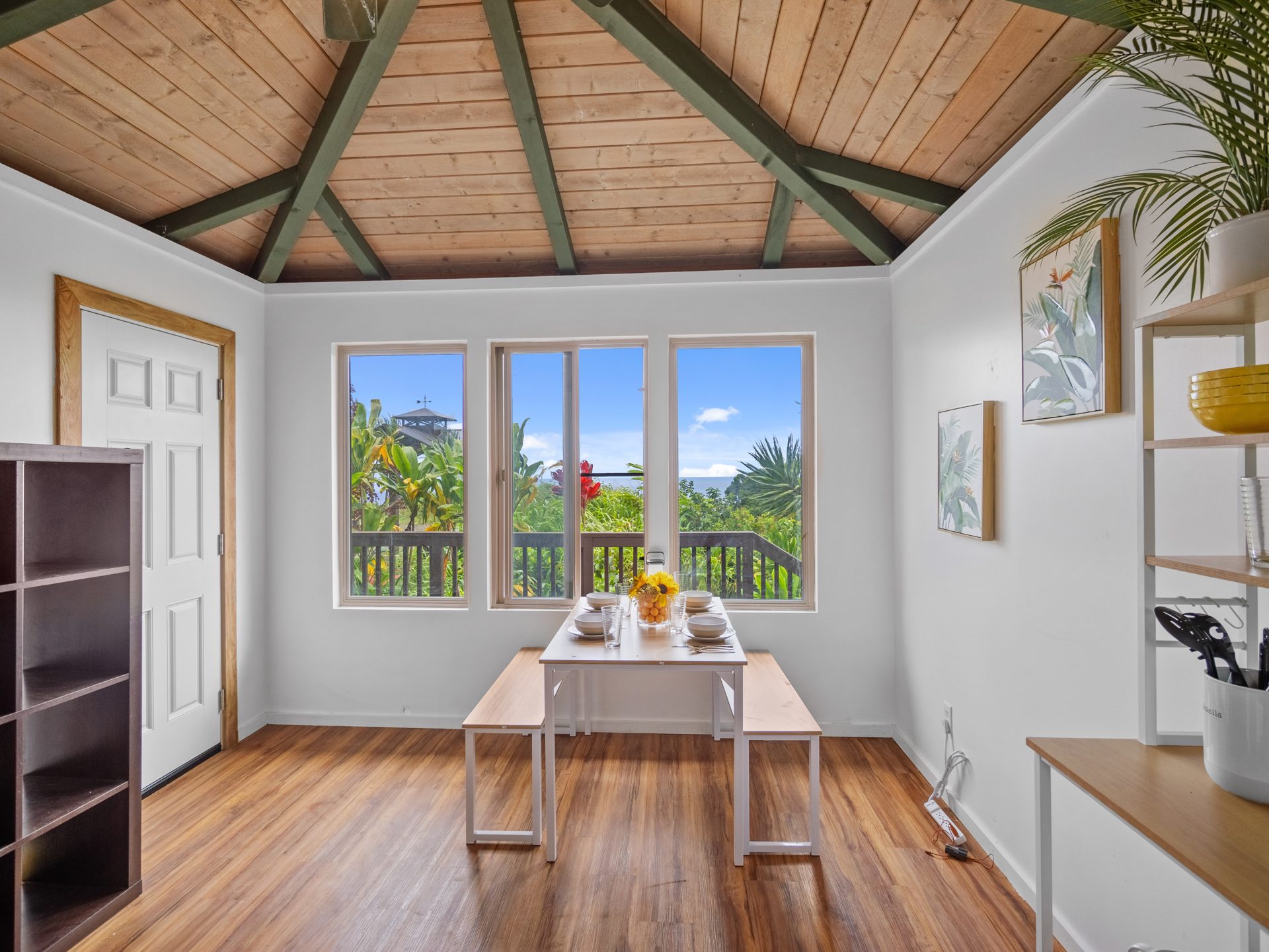 Luxury shed dining area with ocean-view windows