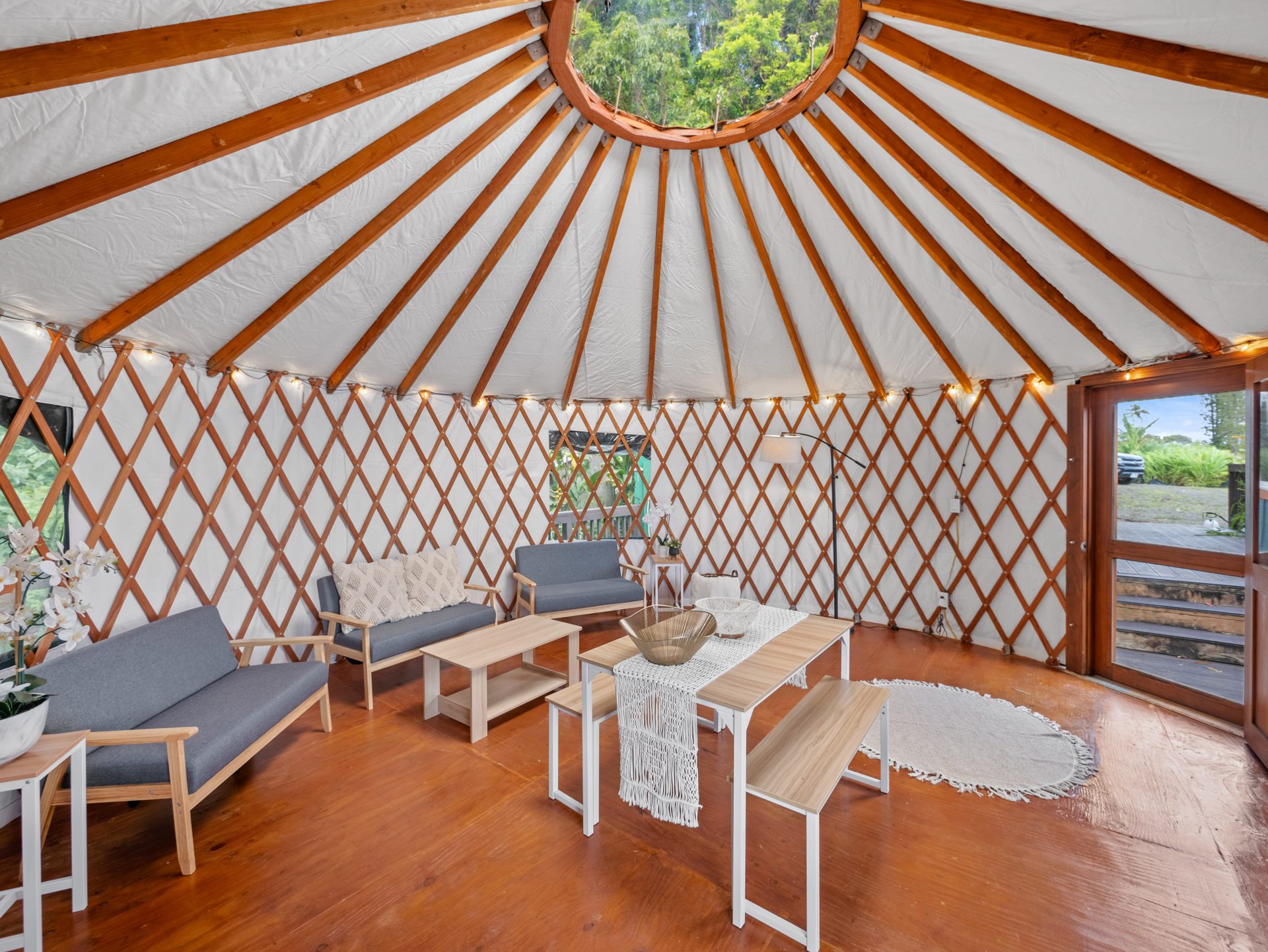 Yurt interior with sofas and dining table